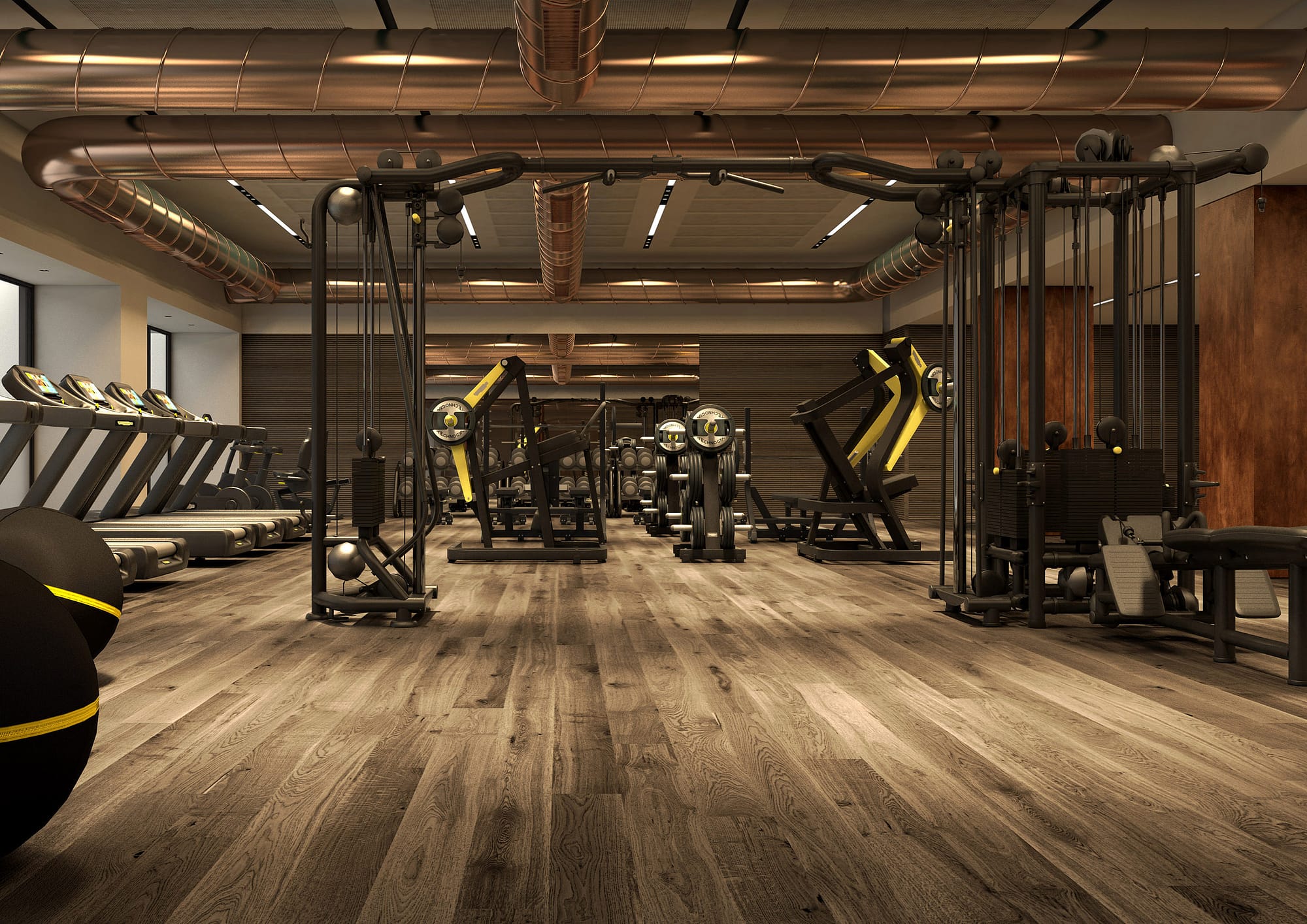 Magneto Fitness Club, gym floor con cable station centrale technogym, impianti a vista e pavimento in rovere